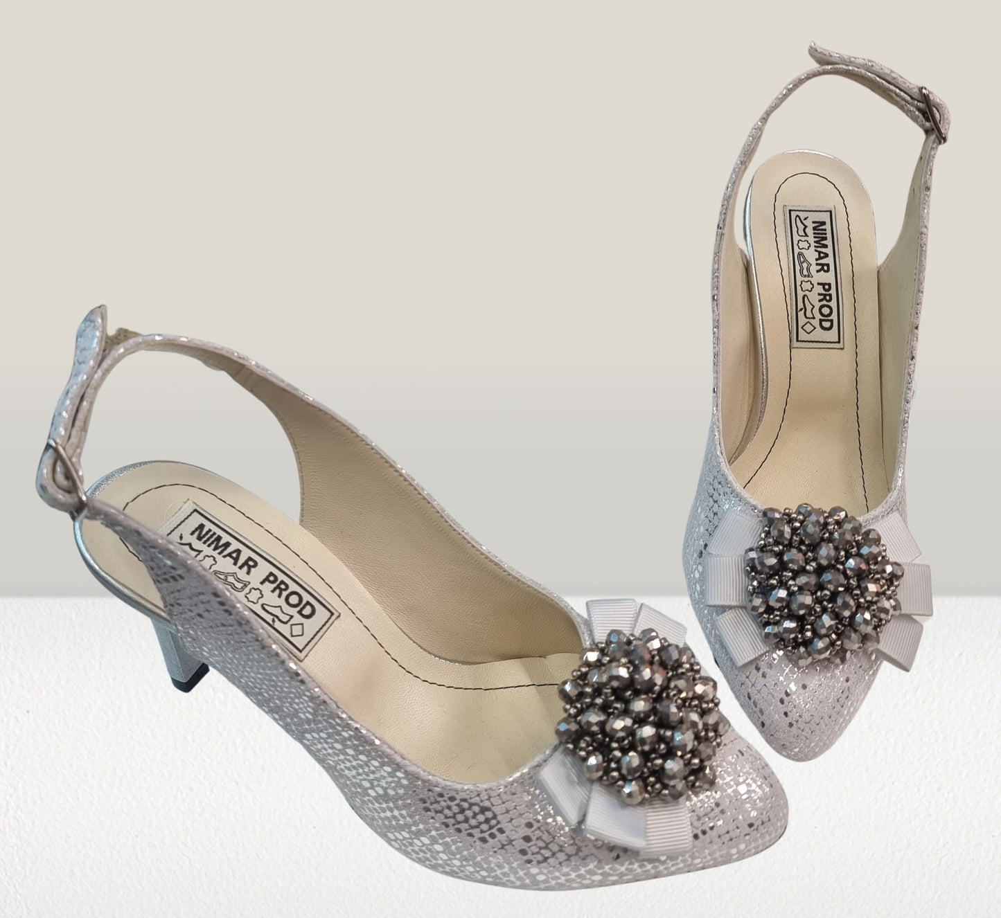 Sandale argintii din piele naturală cu toc și fundiță cu pietre – eleganță pentru evenimente speciale