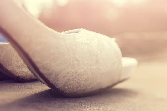 white heeled shoe close-up photography
