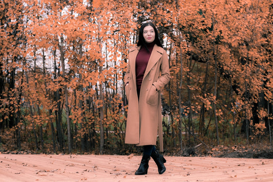 woman standing near trees during daytiame