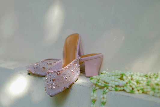 a pair of sandals on a white surface