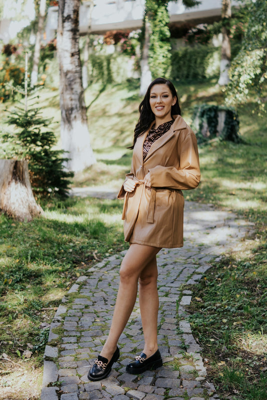 a person in a brown coat