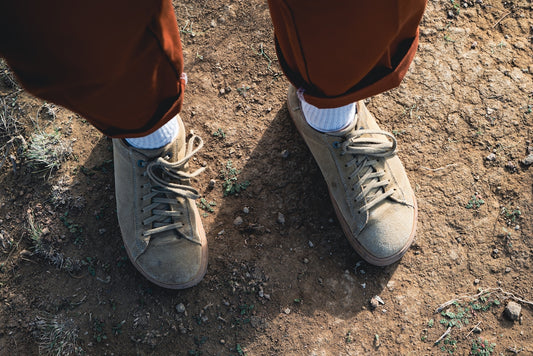 a person standing on top of a dirt field