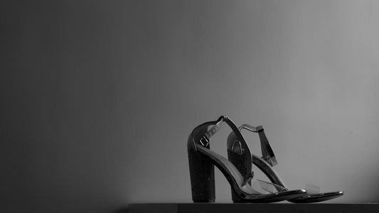 a black and white photo of a pair of shoes