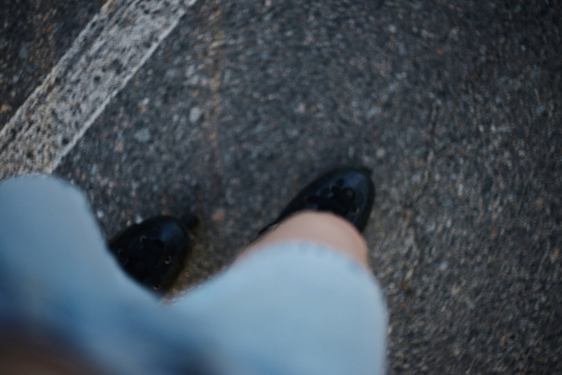 Shoes walk on a road.